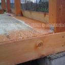 Sheathing the walls of the barn with boards